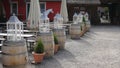 White candle holder on top of Wooden barrels