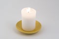 A white candle lit Royalty Free Stock Photo