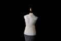 White candle lit burning on black background Royalty Free Stock Photo