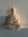 white candle made of soy wax Buddha Royalty Free Stock Photo