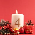 White candle with the number four burns, Advent background