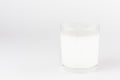 White candle in transparent glass on white background, mock up for branding identity product, advertising, presentation, design.