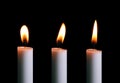 White candle with a yellow candle flame Royalty Free Stock Photo