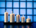 White candles on wood table