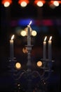 White candlestick with burning candles