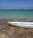 White canoe in the beach.