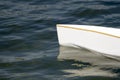 White canoe, kajak and rowing on lake water