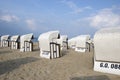 White canopied beach chairs at Baltic Sea