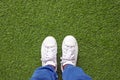 White canvas leather shoes on green lawn Royalty Free Stock Photo