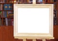 White canvas of wide wood picture frame on easel Royalty Free Stock Photo