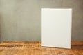 White canvas on wooden table over rustic background. Mock up template Royalty Free Stock Photo