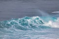 White capped aquamarine wave breaking. Royalty Free Stock Photo