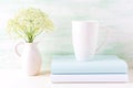 White cappuccino mug mockup with wild meadow flowers in pitcher