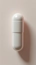 White capsule shaped object on a light background, minimalistic design Royalty Free Stock Photo