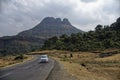 White car on curved road in mountain of Malshej ghat