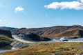 White car drive Norway highway mountain sunny day