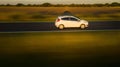 White car driving fast in motion on a rural road Royalty Free Stock Photo