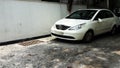 white car parked at road side closeup image