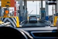 white car passing toll road checkpoint, view from inside a car