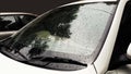 white car rain drops on glass closeup image Royalty Free Stock Photo