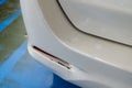 White car rear bumper cracks