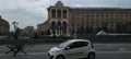 White car on the road of Independence Square with anti-tank obstacles. Kyiv, Ukraine Royalty Free Stock Photo