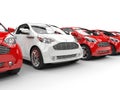 White Car Stands Out in a Row of Red Cars Royalty Free Stock Photo