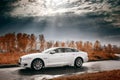 White car stay on wet asphalt road Royalty Free Stock Photo