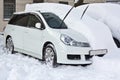 White car is under the snow Royalty Free Stock Photo