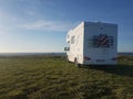 White caravan in front of the sea Royalty Free Stock Photo