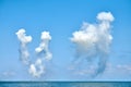 White carbon fiber clouds in blue sky hiding naval destroyers from anti-ship missiles, military show Royalty Free Stock Photo