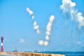 White carbon fiber clouds in blue sky hiding naval destroyers from anti-ship missiles, military show Royalty Free Stock Photo