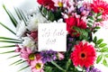 White card for a bouquet with the inscription I love you in German in a bright beautiful bouquet of flowers Royalty Free Stock Photo