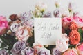 White card for a bouquet with the inscription i love you in german in a bright beautiful bouquet of flowers roses Royalty Free Stock Photo