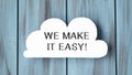 cloud shape with text WE MAKE IT EASY on stylish wooden background