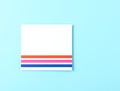 White Card with Colorful Horizontal Stripes on Blue Background Royalty Free Stock Photo