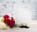 White card mockup with Bow tie and bouquet of white and red roses. Happy birthday greeting card concept father`s day or Royalty Free Stock Photo