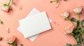 White card mockup with space for text on a white envelope on a pink background. Soft pink roses with a random layout.
