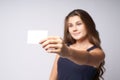 White card. Portrait girl. Blurred background. Arm