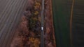 White cargo truck driving dirt road between agricultural fields countryside. Royalty Free Stock Photo