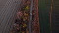 White cargo truck driving dirt road between agricultural fields countryside. Royalty Free Stock Photo