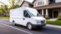 White cargo van with blank space on side driving down tree lined suburban street with houses in background Royalty Free Stock Photo