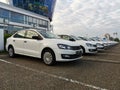 White cars are standing in a row. There are new cars for sale. Sale of new cars in car dealerships. Royalty Free Stock Photo