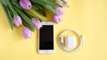 White case IPhone, iPods and flowers on yellow background