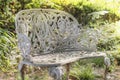 White cast iron bench in the garden of Asukayama park in the Kit