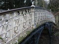 White cast-iron bridge in a park