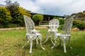 White cast iron table and chairs in garden