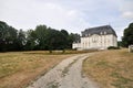 A white castle or palace with a black roof