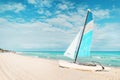 white catamaran blue sail on white sandy beach with retro effect. beach of Varadero in Cuba Royalty Free Stock Photo