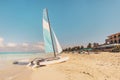 white catamaran blue sail on white sandy beach with retro effect. beach of Varadero in Cuba Royalty Free Stock Photo